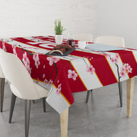 Red cherry blossom tablecloth with gold diagonal bands and pink floral print