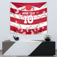 Red and white cherry blossom tapestry hanging on wall with large number 10