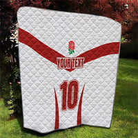 White and red quilt throw with red rose emblem, YOUR TEXT, and large 10 on quilt