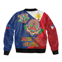 Blue and red bomber jacket with carnival mask back print and “MassKara Festival” lettering
