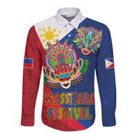 Long sleeve button shirt with central mask artwork and “MassKara Festival” lettering, blue and red