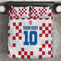 White duvet and pillow shams with red checkered pattern and number 10 custom text