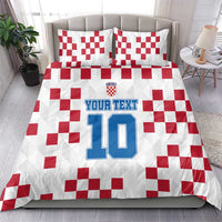 White bedding set with red checkered design, custom text, and large number 10