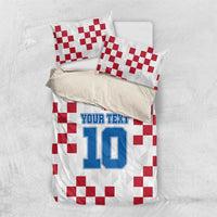 White bedding set with red checkered pillows and custom text number 10 print