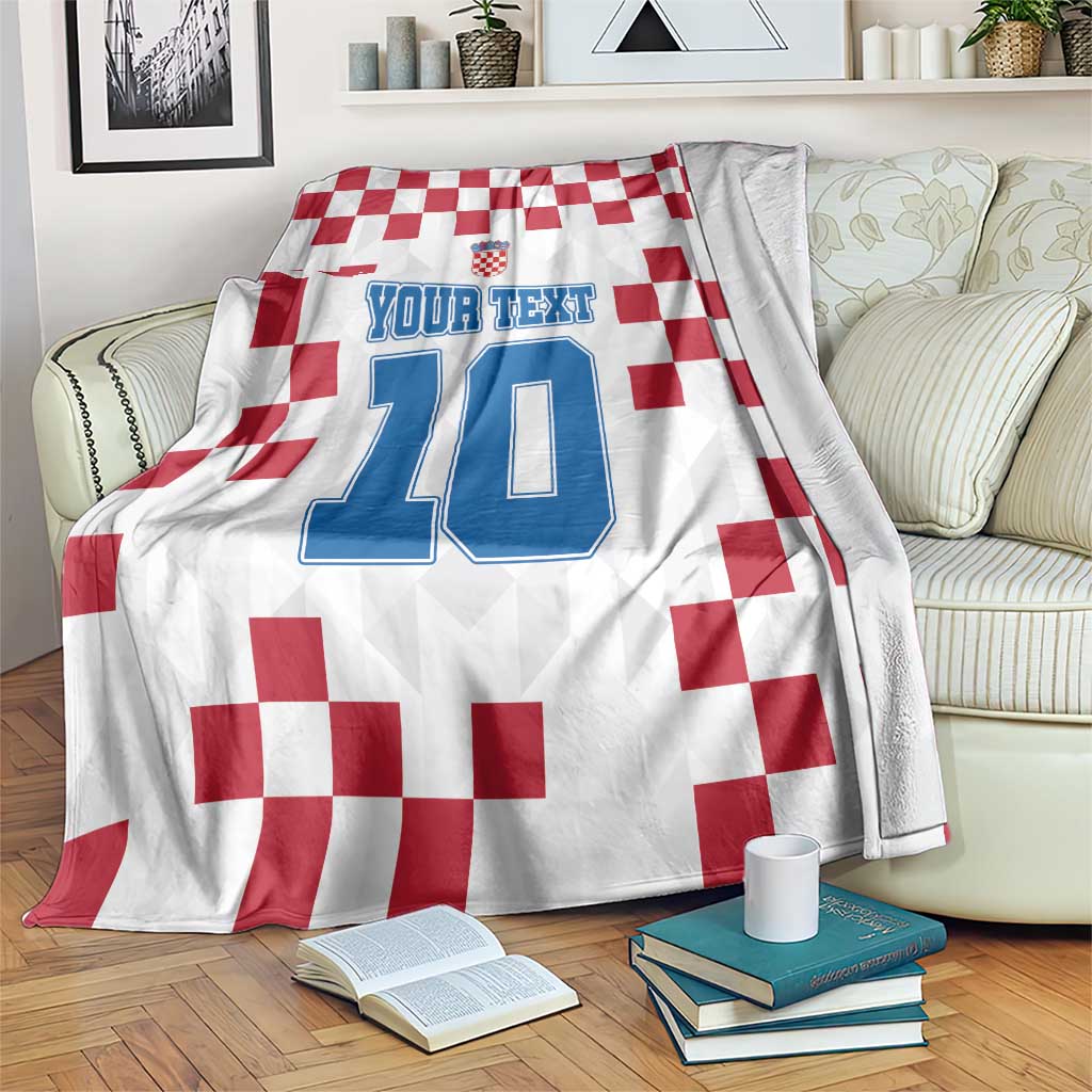 Croatia football blanket draped with red checker print, crest, and blue number 10