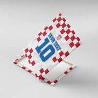 Unframed canvas wall art on wooden easel, red check border, Croatia crest, and blue 10