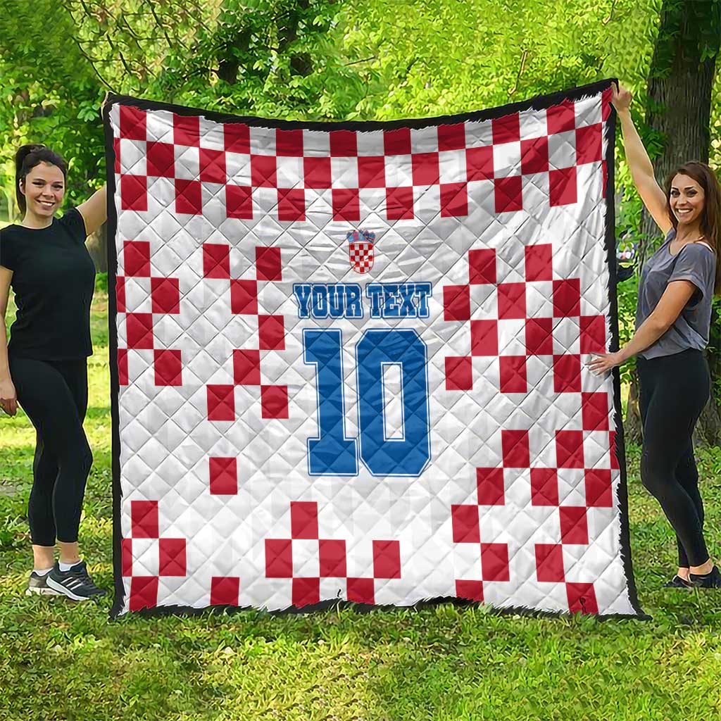 Custom white quilt with red check pattern and blue jersey-style number 10 design