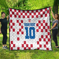 Custom white quilt with red check pattern and blue jersey-style number 10 design