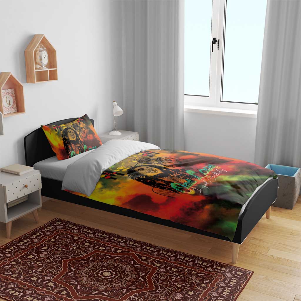 Reggae-themed duvet on bed, portrait and One Love text with red yellow green color wash