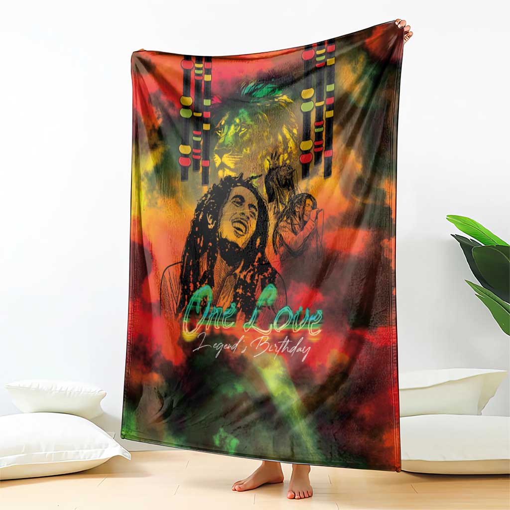 Reggae-themed blanket draped, reggae legend portrait with 'One Love' text in red and green