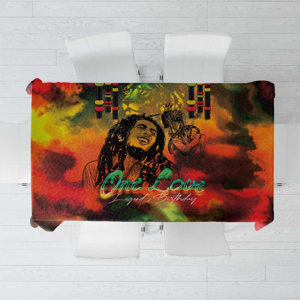 Reggae-themed birthday tablecloth with multicolor print and central portrait, One Love text