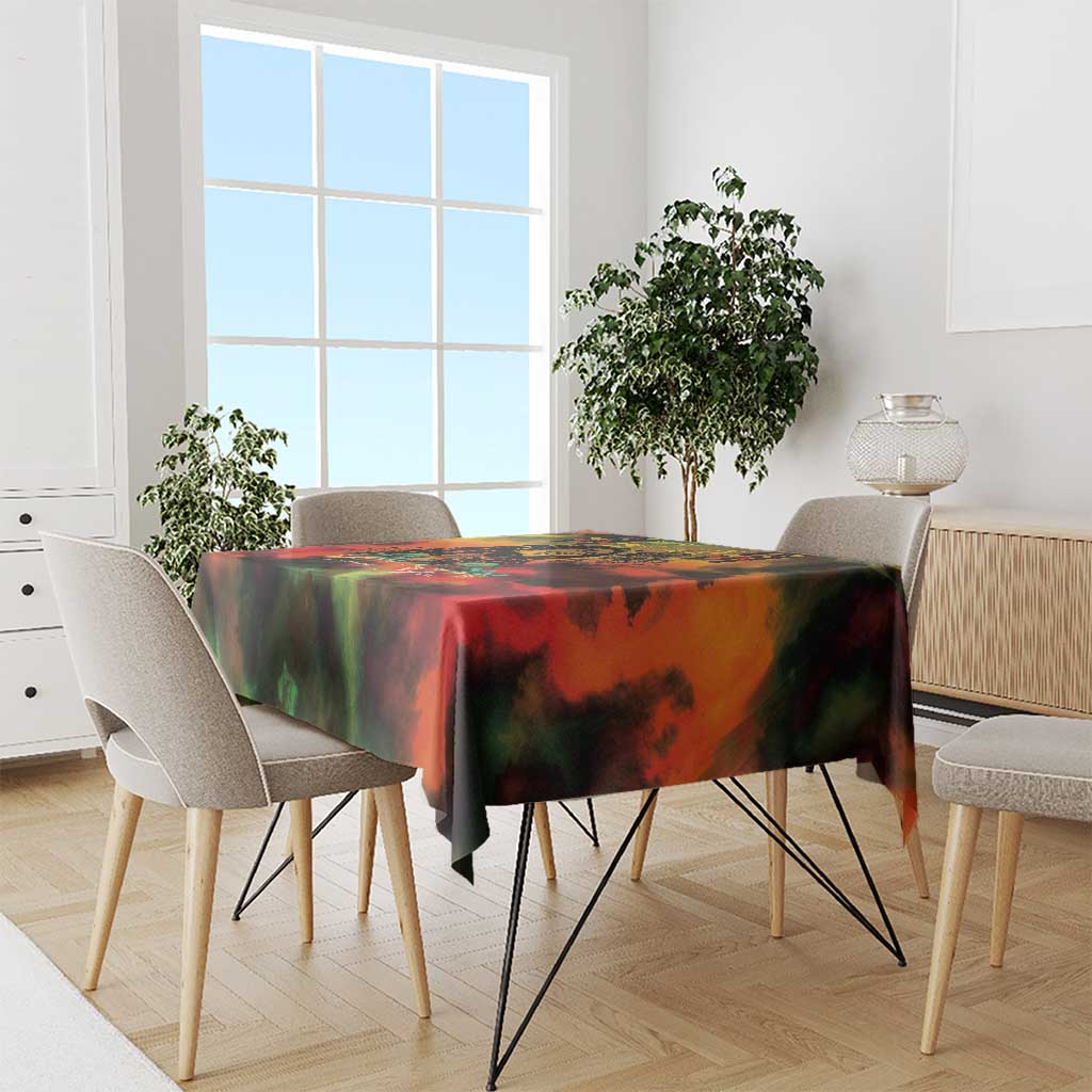Reggae-themed tablecloth in red, green, yellow and black on a dining table with chairs