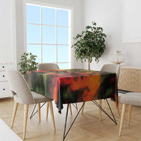 Reggae-themed tablecloth in red, green, yellow and black on a dining table with chairs