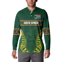 Green long-sleeve button sweatshirt with front graphic and patterned sleeve bands
