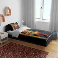 Black bedding set with Black History Month face artwork and rainbow stripe panel on duvet
