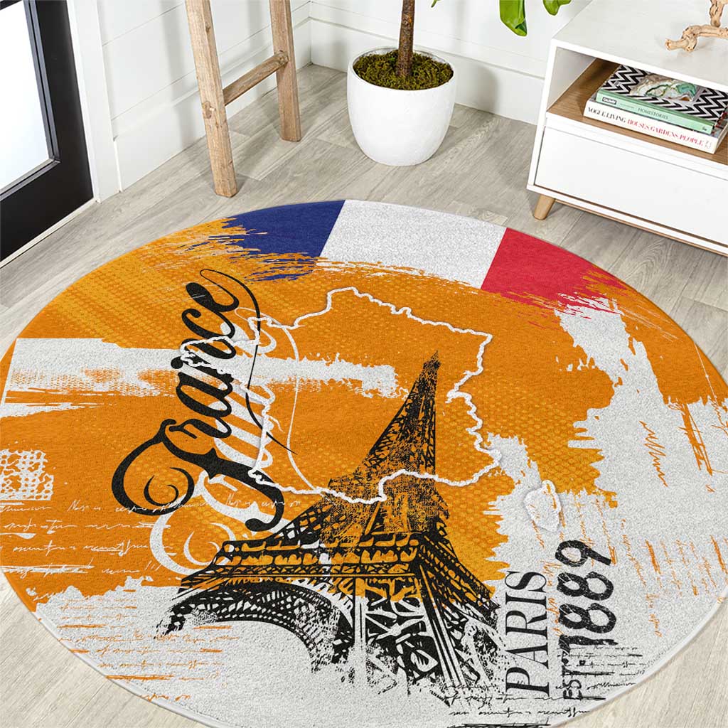 Round France typography grunge area rug in orange with blue/red panels and Eiffel print