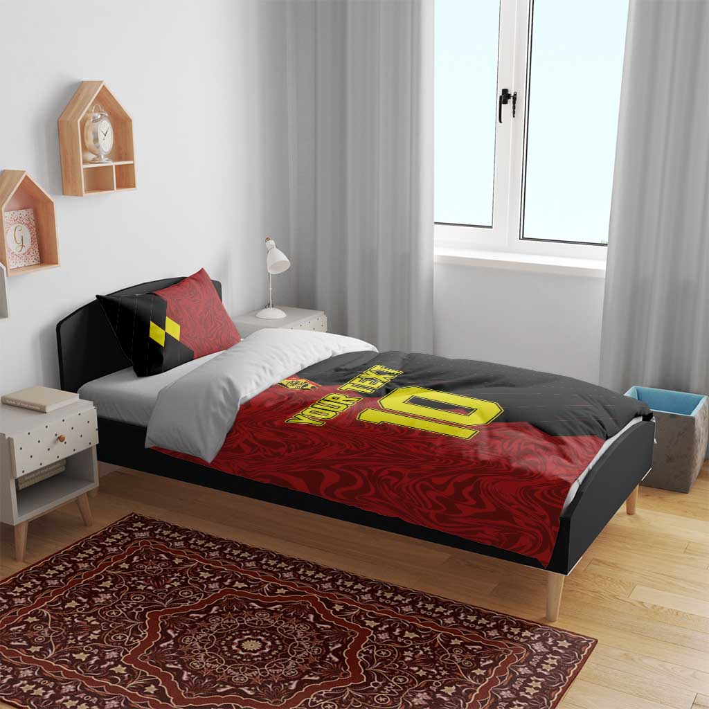Red and black duvet cover on bed with two matching pillow shams and yellow number 10