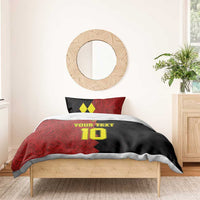 Red and black football bedding set with two pillow shams and yellow number 10 on duvet