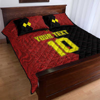 Red/black quilt bed set with yellow 'YOUR TEXT' and large '10', two pillows visible