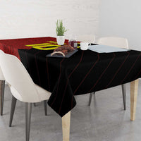 Corner view of red and black football tablecloth with diagonal stripe pattern