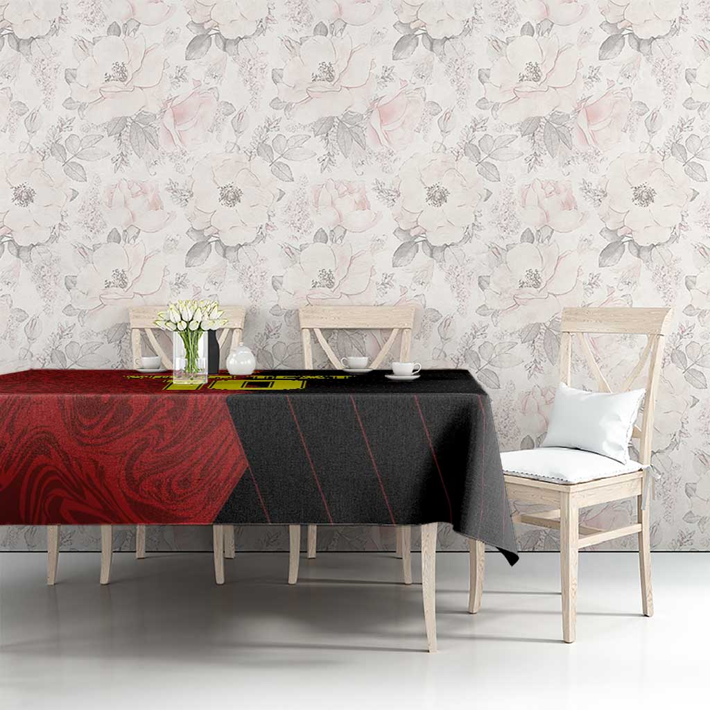 Red and black football tablecloth on dining table with matching chairs