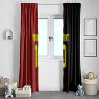 Red custom window curtain hanging beside black panel, printed text and large number