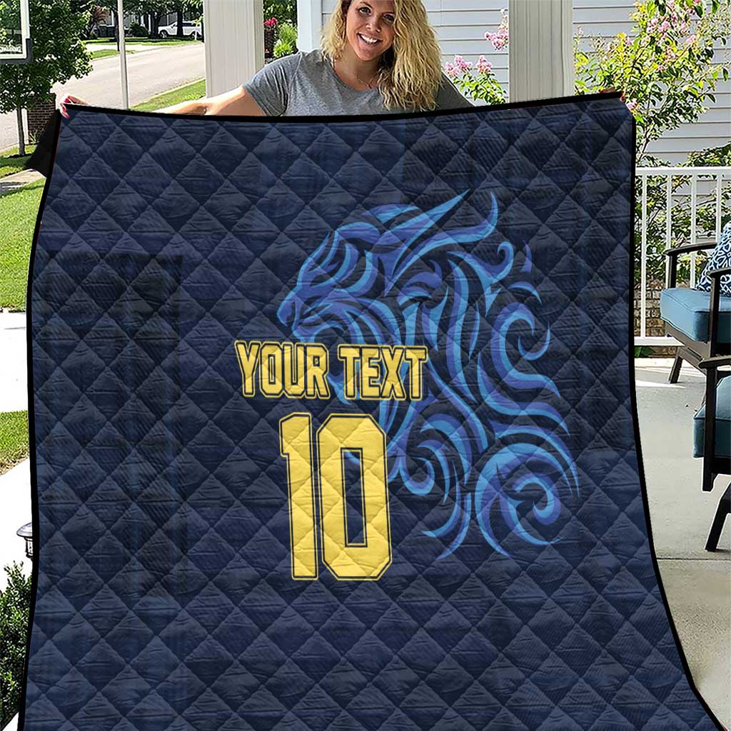 Blue quilt with diamond stitching, “YOUR TEXT” and gold number 10 with blue swirl