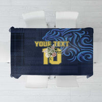 Navy blue custom tablecloth with yellow emblem and blue swirl graphics