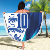 Round beach blanket with fringe, blue/white England “YOUR TEXT 10” graphic held outdoors