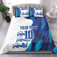 Football bedding set in blue and teal stripes with lion crest, 'YOUR TEXT' and number 10, on bed