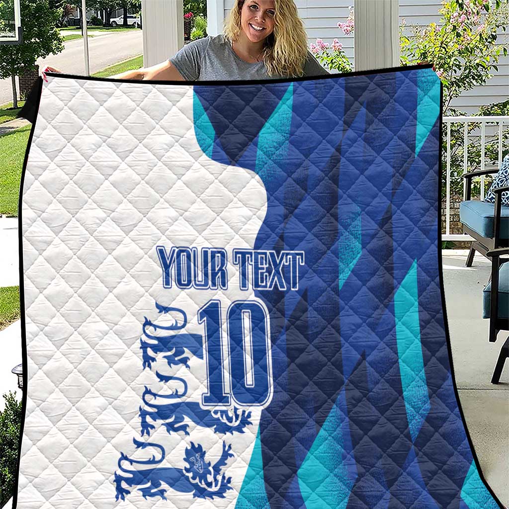 England football quilt close-up, white-and-blue panels with lion crest and number 10