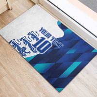 Blue rubber doormat corner view with “YOUR TEXT” and number 10 crest