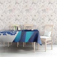 Blue and teal geometric tablecloth on dining table with chairs