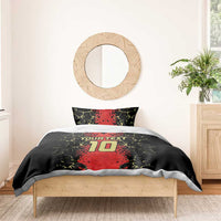 Football bedding set on bed: black duvet with red number 10 and 'Your Text', 2 pillows