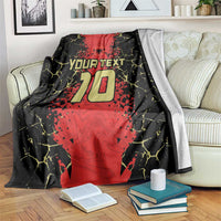 Black and red custom football blanket on couch with shield crest and 20 jersey print