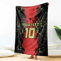 Black and red custom football blanket hanging with shield crest and 10 graphic