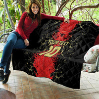 Quilt blanket on couch showing black base with red football jersey, number 10, and custom text.