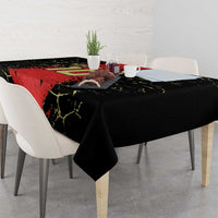 Custom tablecloth with black and red football design, crackle pattern, draped on a dining table