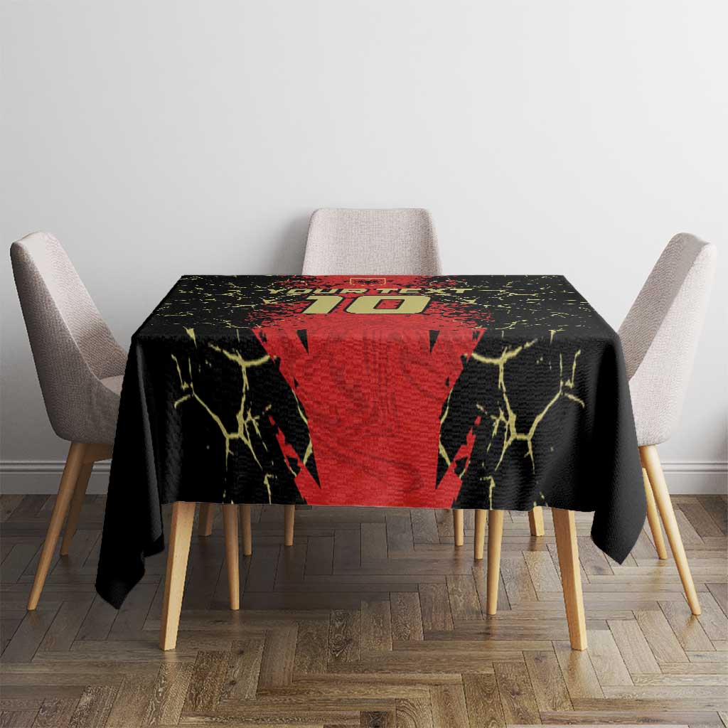 Black and red football-themed tablecloth with yellow crackle accents, on a dining table with chairs