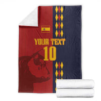 Custom Spain football blanket folded, red and navy panels with lion graphic and diamond stripes