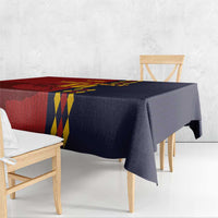 Red and navy Spain-themed tablecloth with diamond stripe section along table edge.