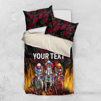Personalized bedding set flat lay: duvet and two pillowcases, 'YOUR TEXT' with flames