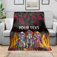 Personalized racing blanket with horse riders, roses & flames, 'YOUR TEXT' on couch