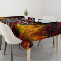 Black flame-and-rose tablecloth covering dining table with chairs and decor