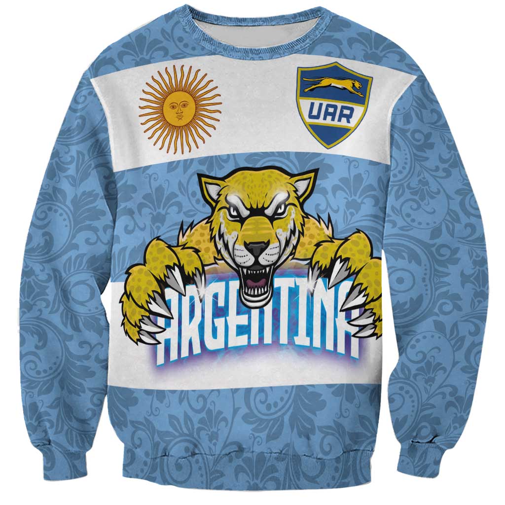 Blue and white sweatshirt with jaguar graphic, sun logo, and UAR badge
