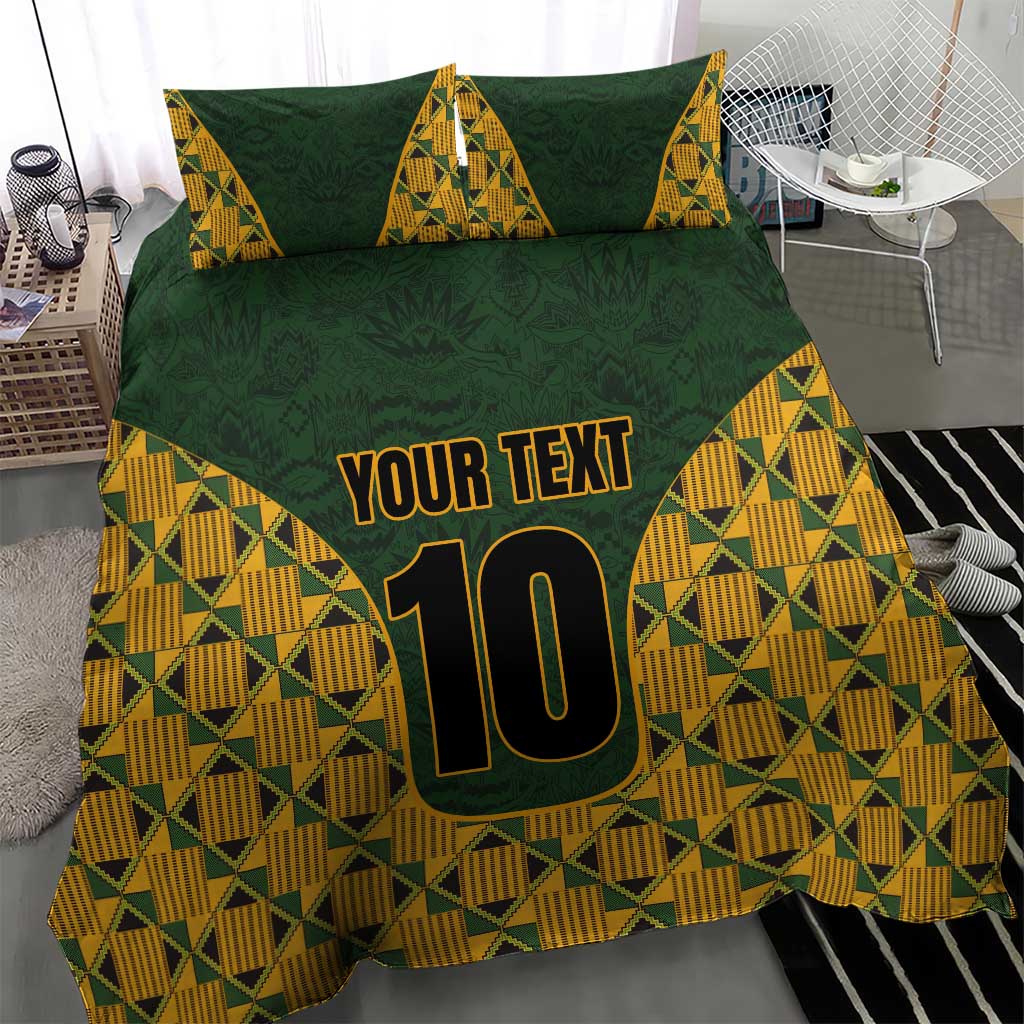 Green bedding set with kente triangle design, 'YOUR TEXT' and number 10 on cover.