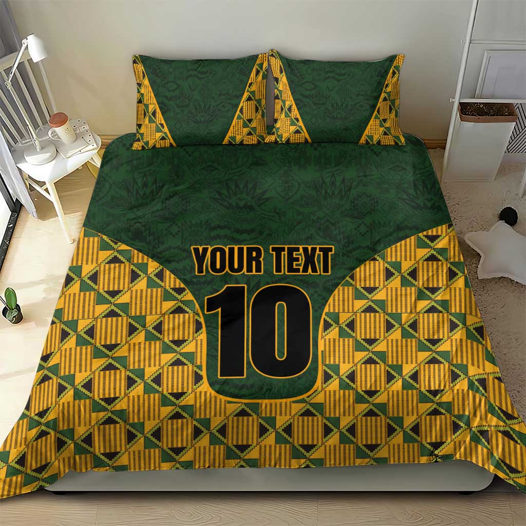 Green bedding set with kente triangle pattern, 'YOUR TEXT' and number 10 on duvet and pillows.