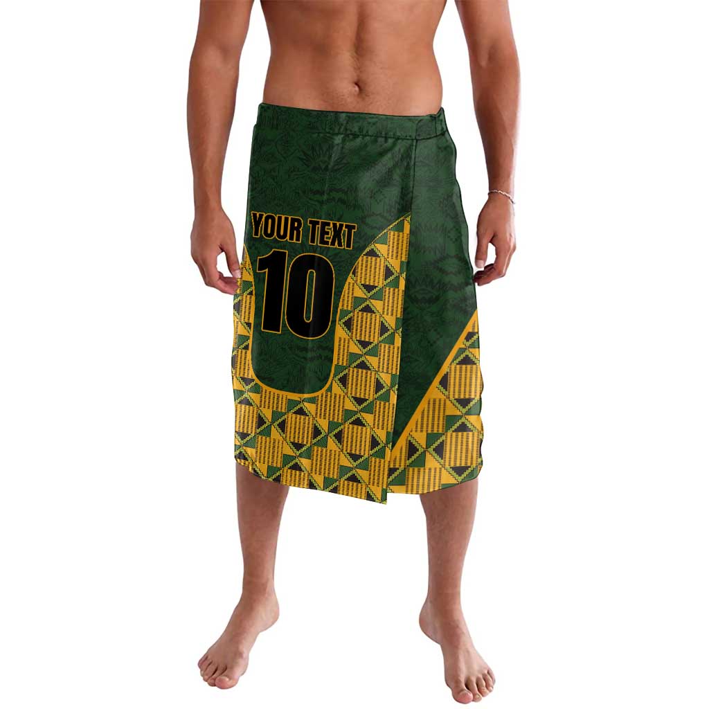Green elastic-waist shorts with yellow kente geometric panels and printed number 10