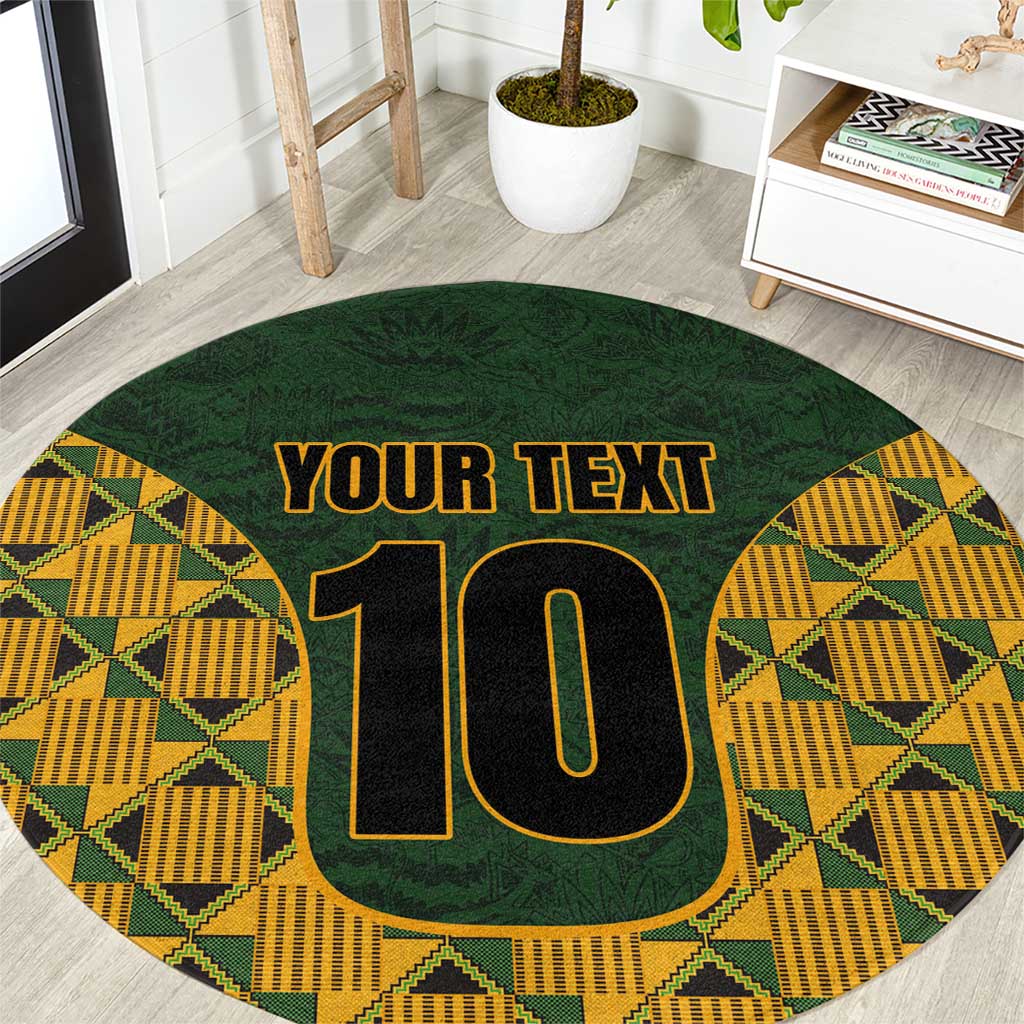 Round green rug with yellow kente border, bold black "10" and "YOUR TEXT".