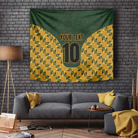 Green and yellow geometric kente tapestry wall hanging with gold '10' and 'YOUR TEXT'.
